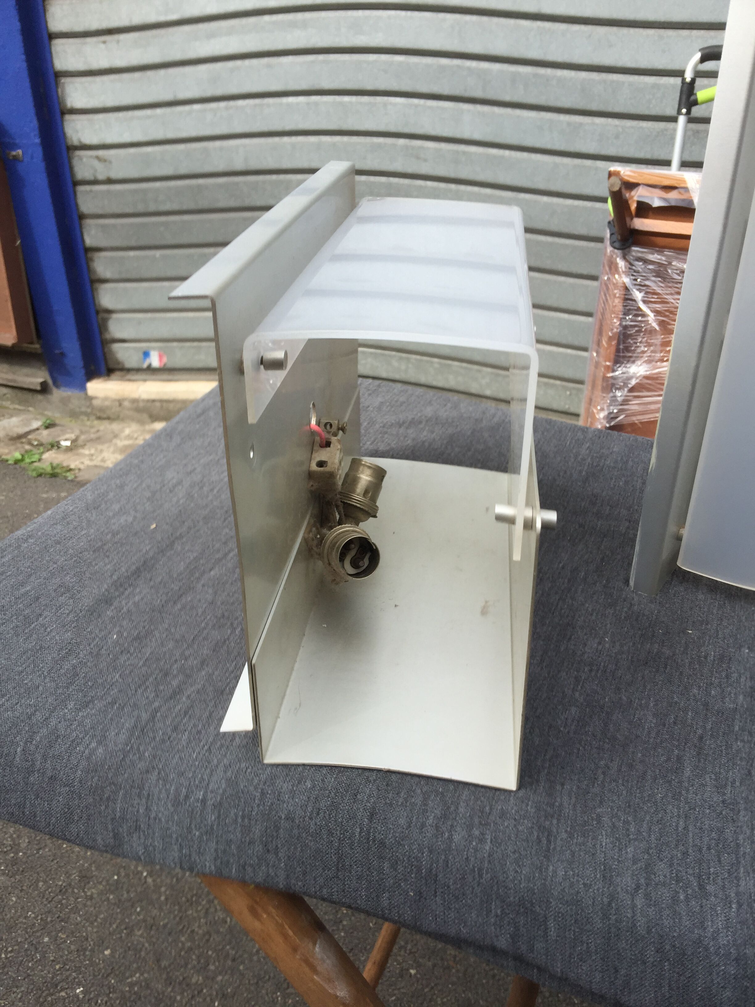 Pair of aluminum and translucent rodohide sconces 1970