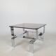 Table basse métal chromé et verre fumé 70