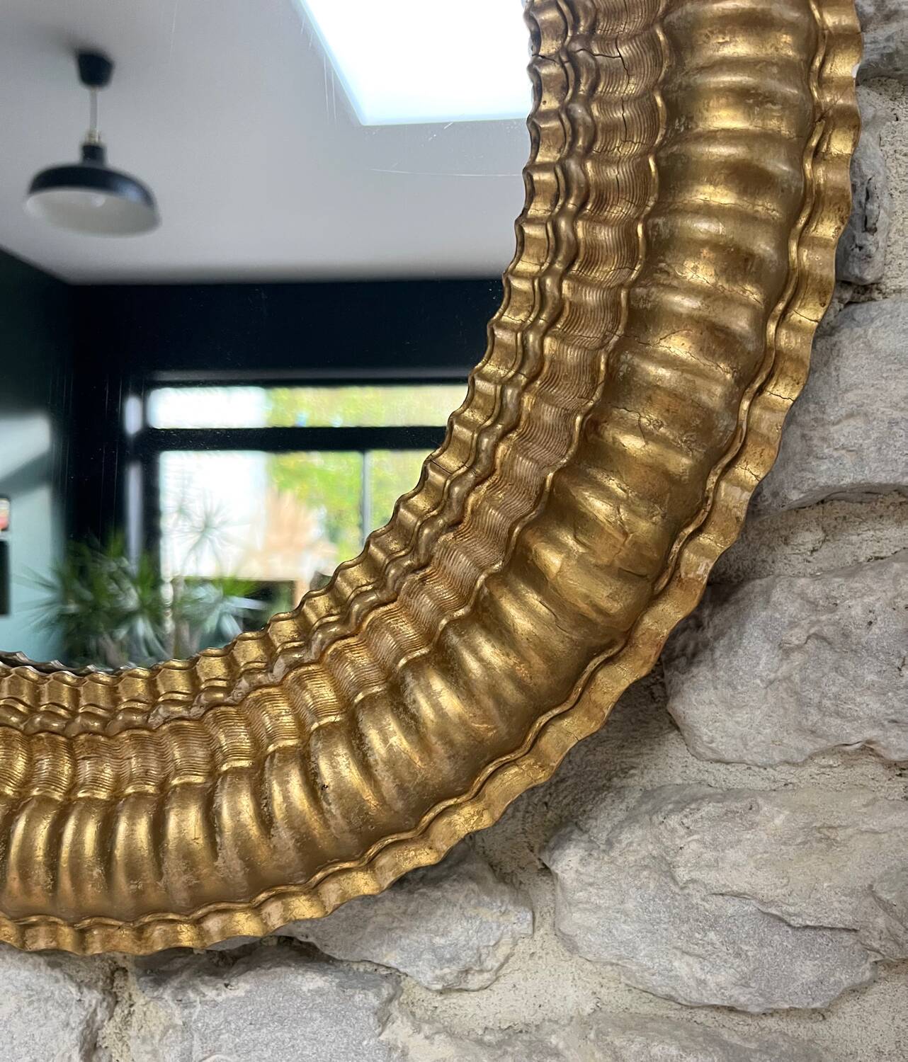 Pair of antique oval mirrors gilded with gold leaf and mercury.