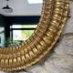 Pair of antique oval mirrors gilded with gold leaf and mercury.