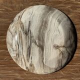 Tray, circular dish or plate made of white striped grey petrified wood.