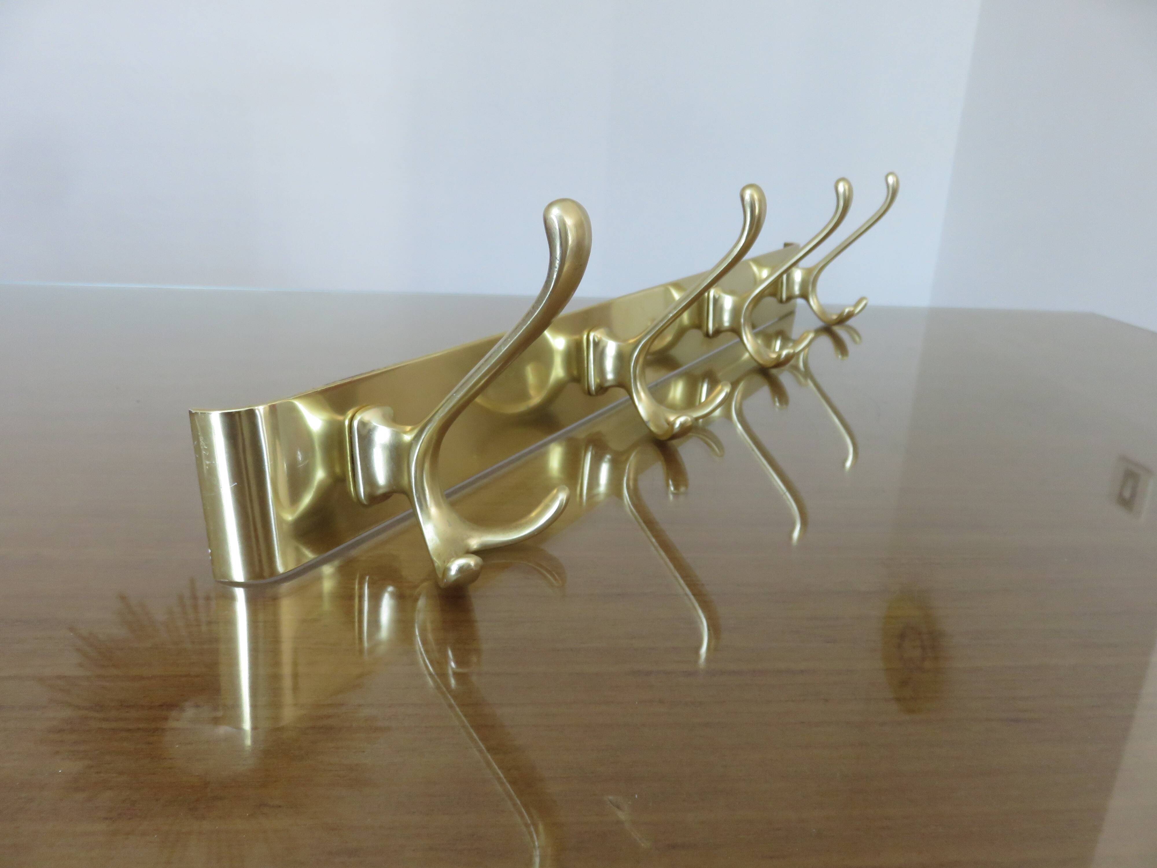 Large wall-mounted coat rack in gold aluminum, 60s-70s