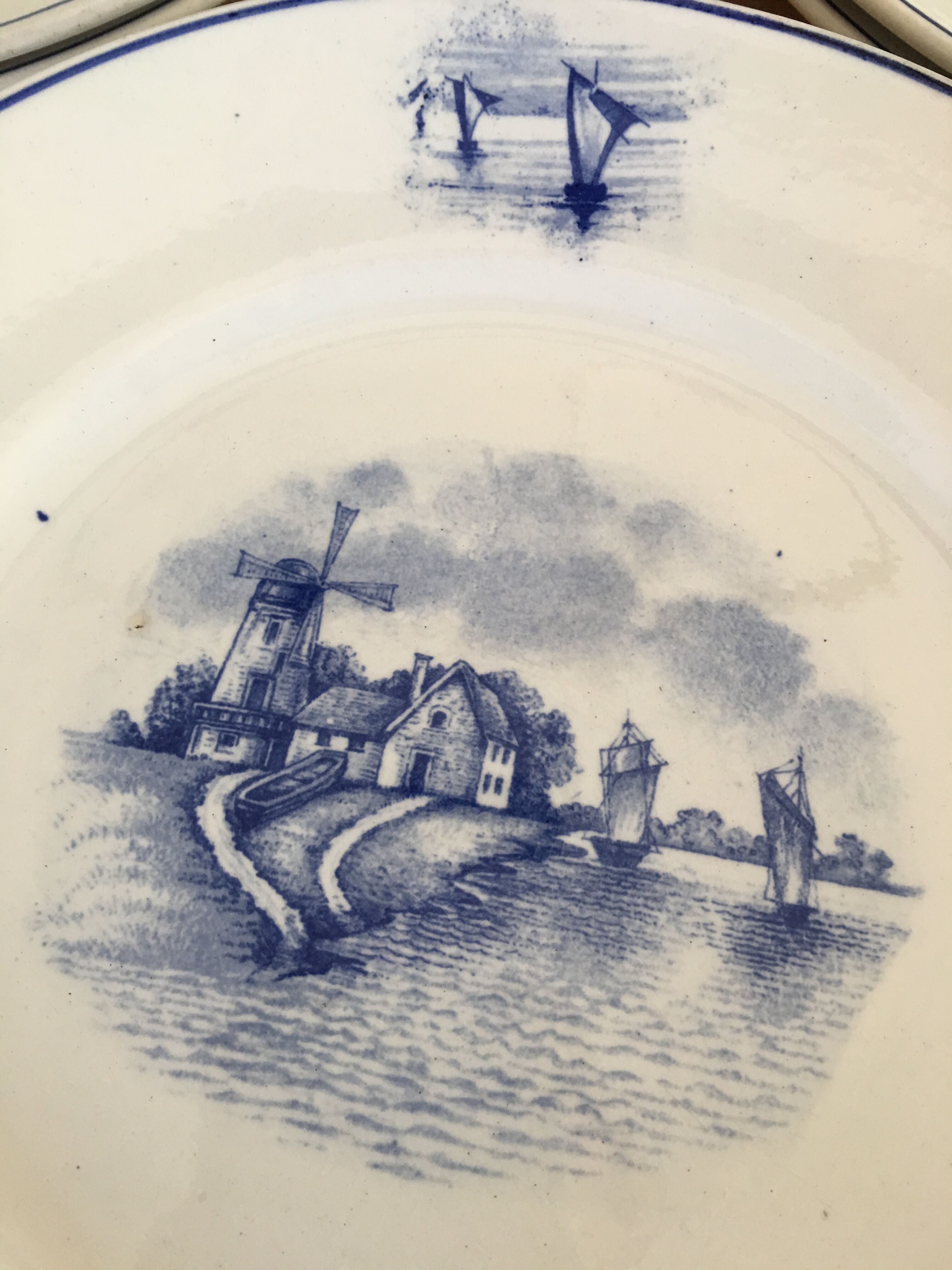 Series of 11 flat plates, Dutch earthenware, early XX