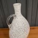 Pitcher vase in the shape of a gourd 1940 gray speckled on a white background