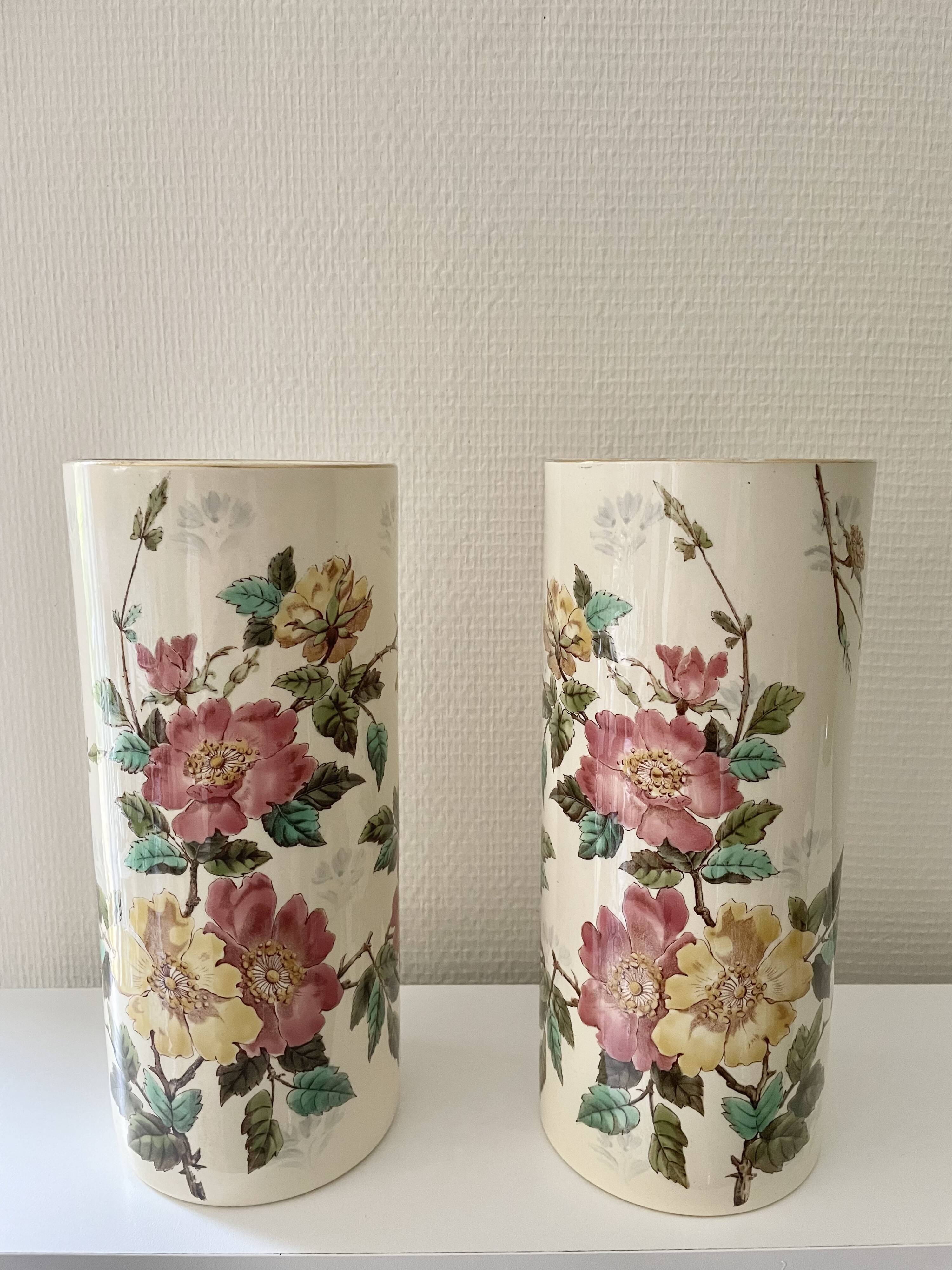Roller vases in earthenware with floral decoration of wild rose, circa 1930–1950.