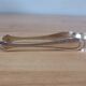 vintage silver metal sugar tongs