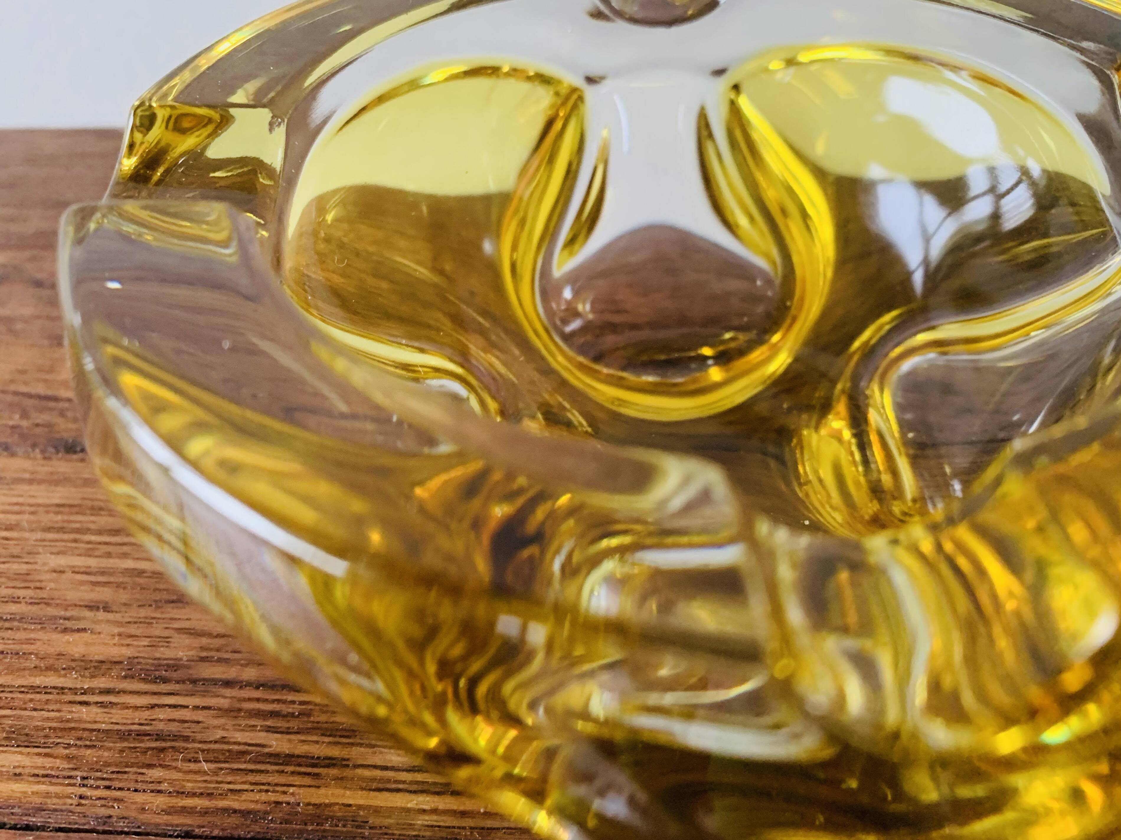 Vintage ashtray in yellow and transparent molded glass