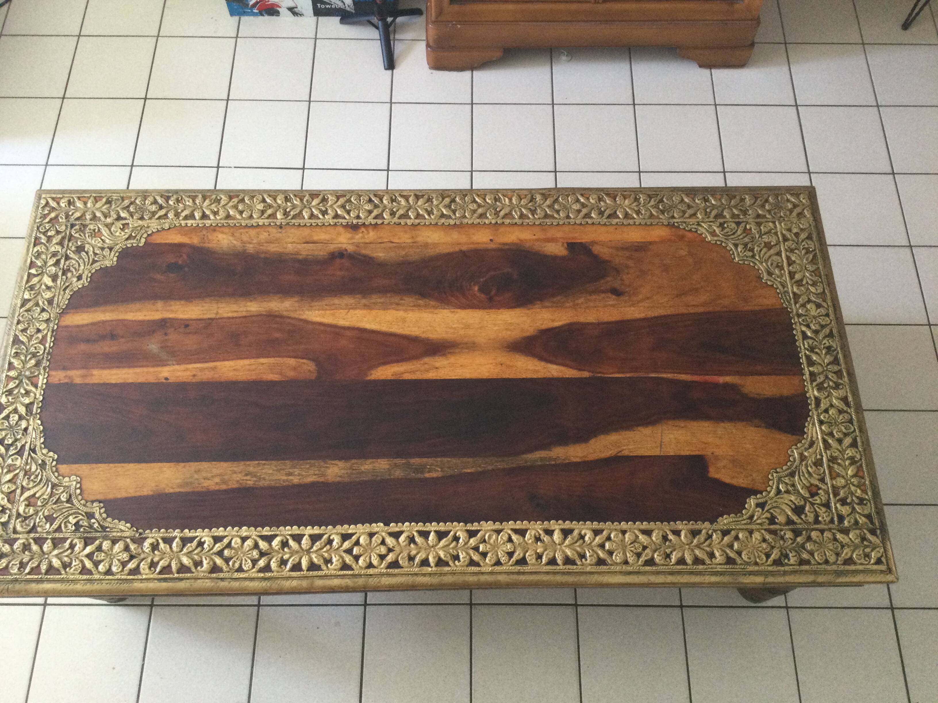 Large vintage Indian coffee table made of solid sheesham wood and brass.