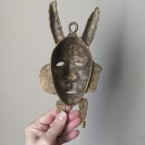 Handcrafted bronze wall mask, Sénoufo African art.
