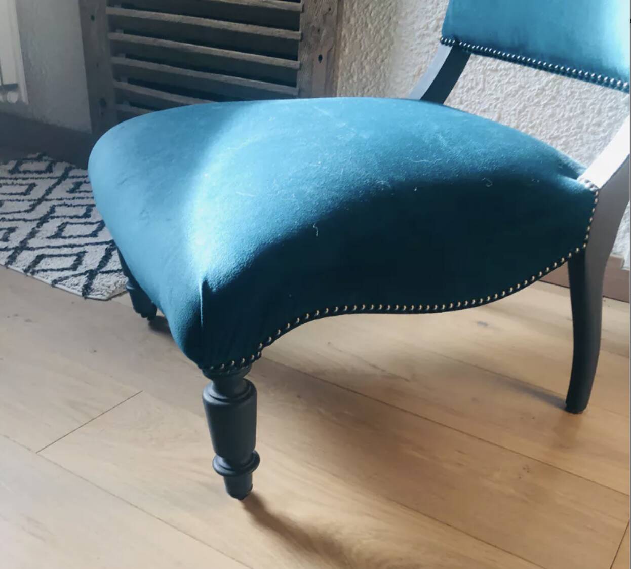 Velvet and studded armchair