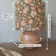 Table lamp with a wooden ball base, floral print in bohemian style.