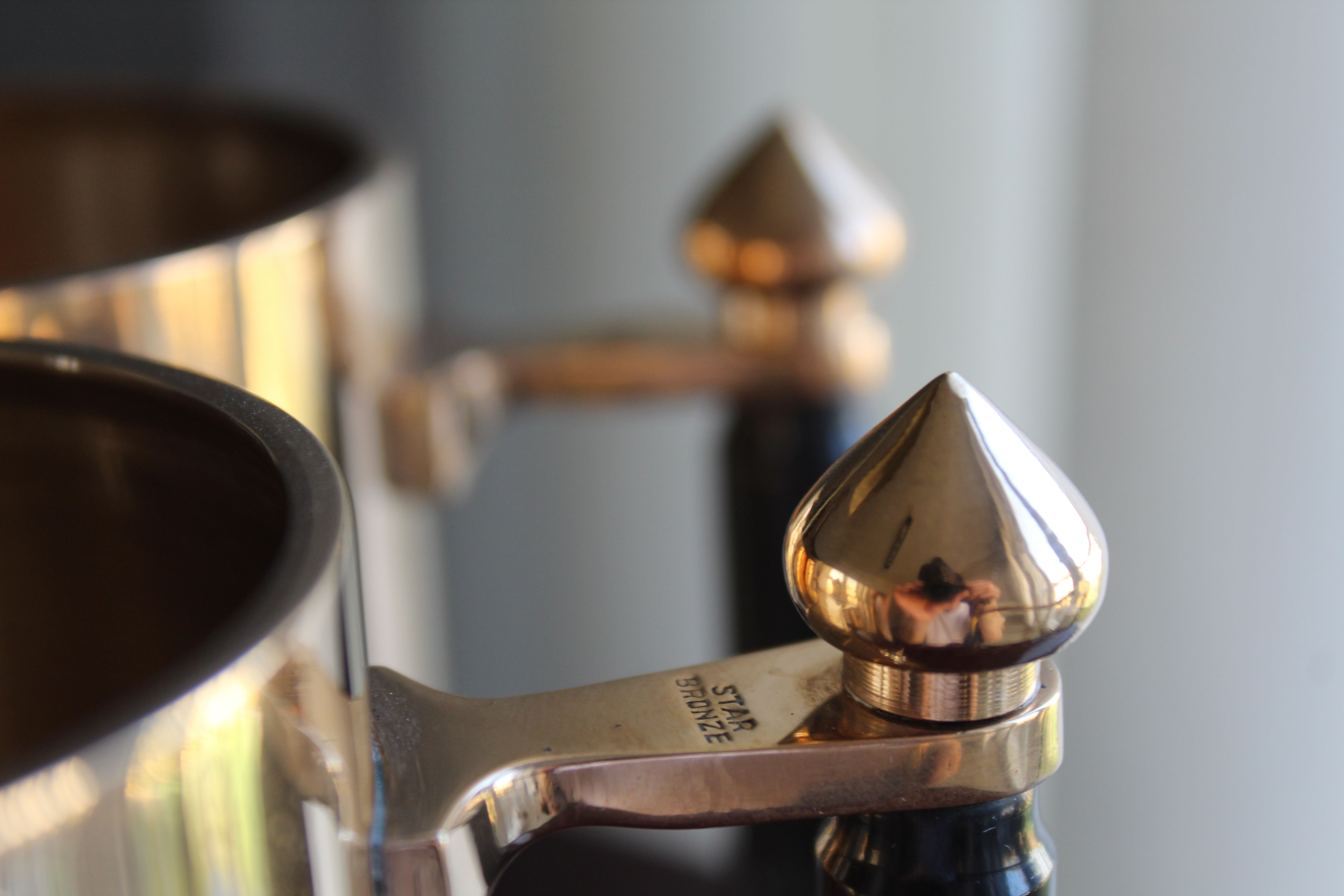 Pair of art deco bronze beer mugs France, 1940s, signed Bronze Star