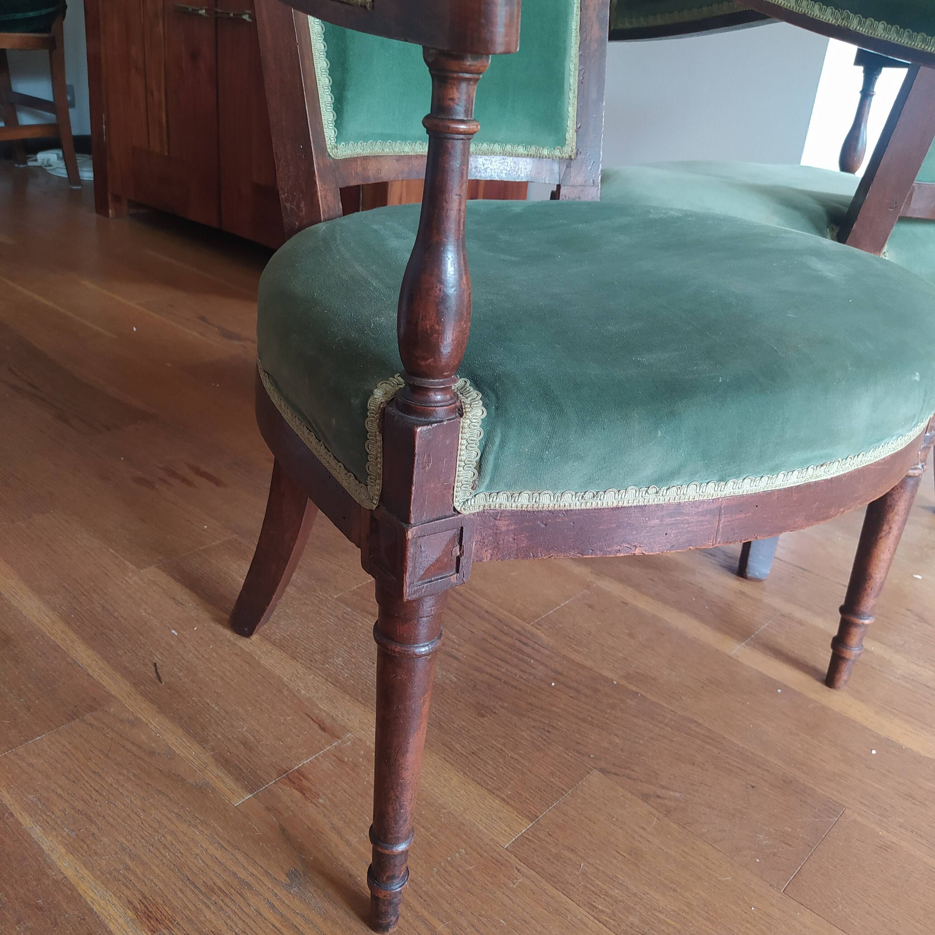 pair of Directoire armchairs in walnut, early 19th century, green velvet