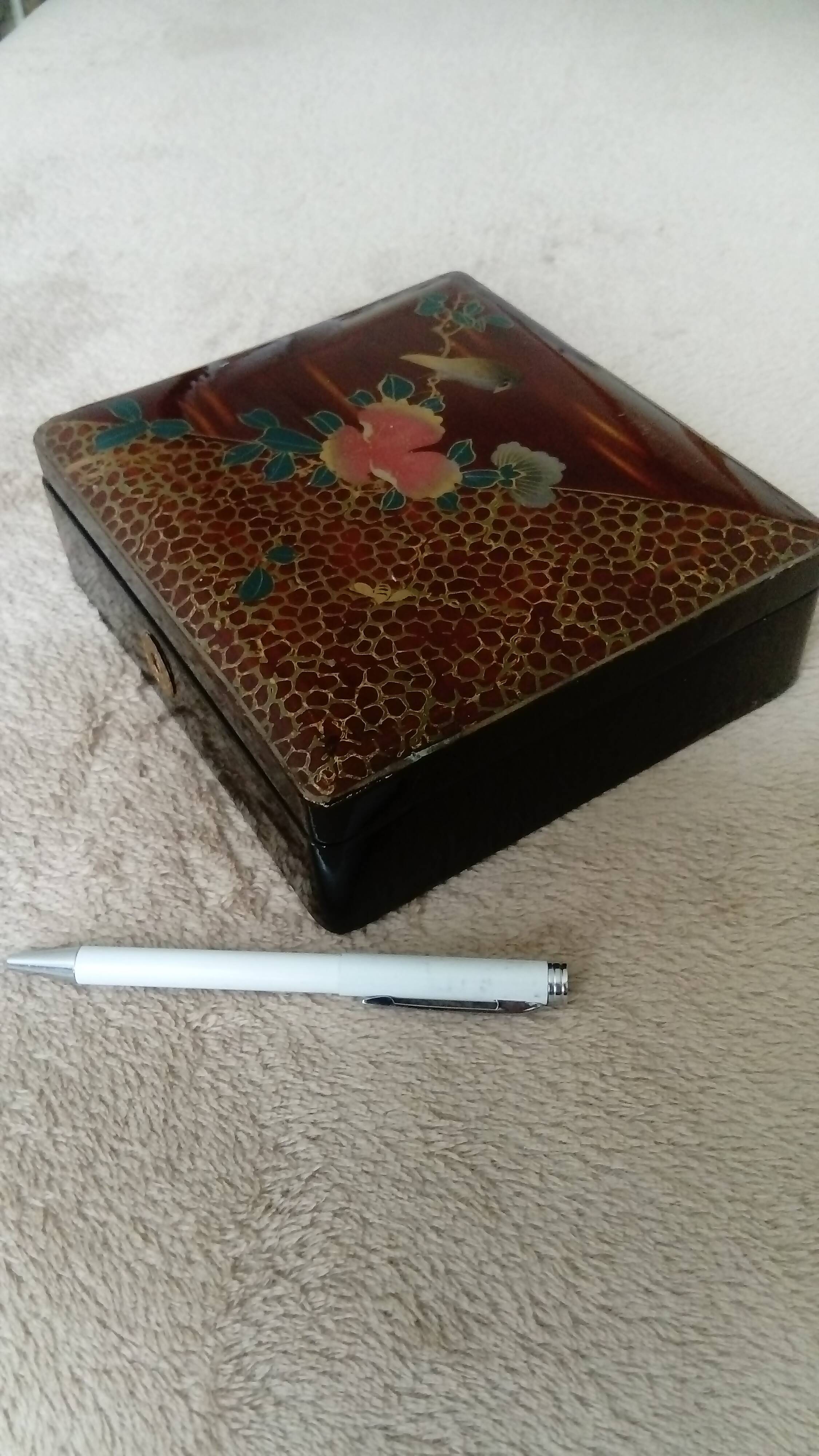 Old lacquered jewelry box with Asian decoration bird, flower, bee