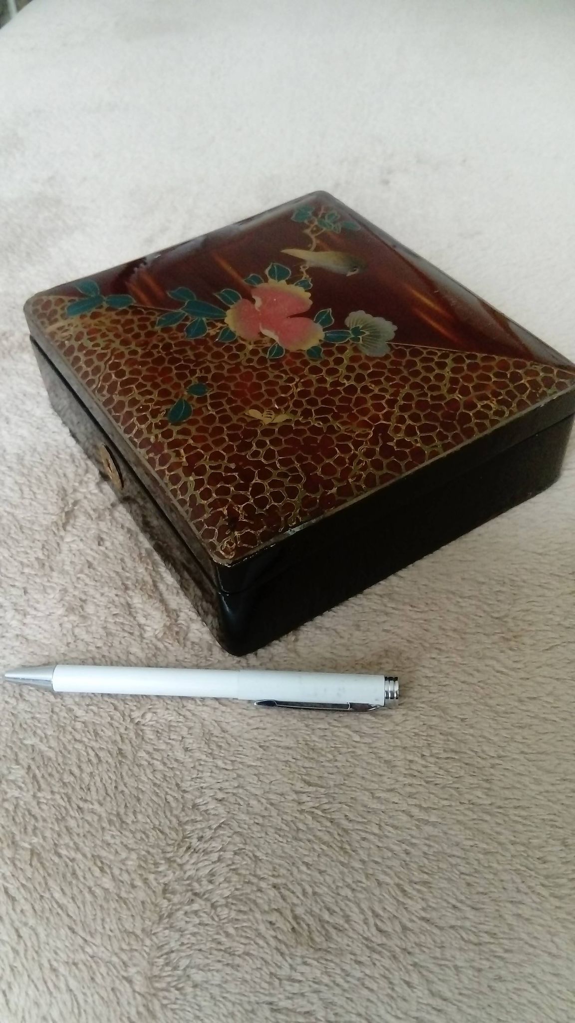 Old lacquered jewelry box with Asian decoration bird, flower, bee