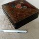 Old lacquered jewelry box with Asian decoration bird, flower, bee