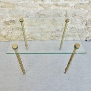 End of sofa, glass and twisted legs in gilded metal