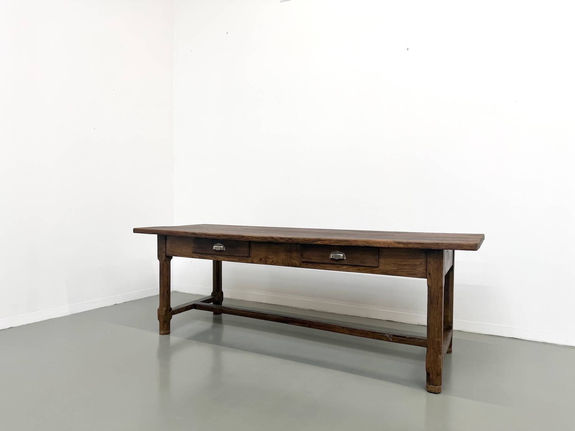 Authentic French farmhouse table from 1890 in solid oak with two drawers.