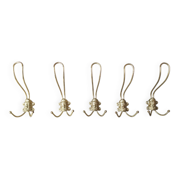 set of 5 antique gold metal coat hooks with heads of men