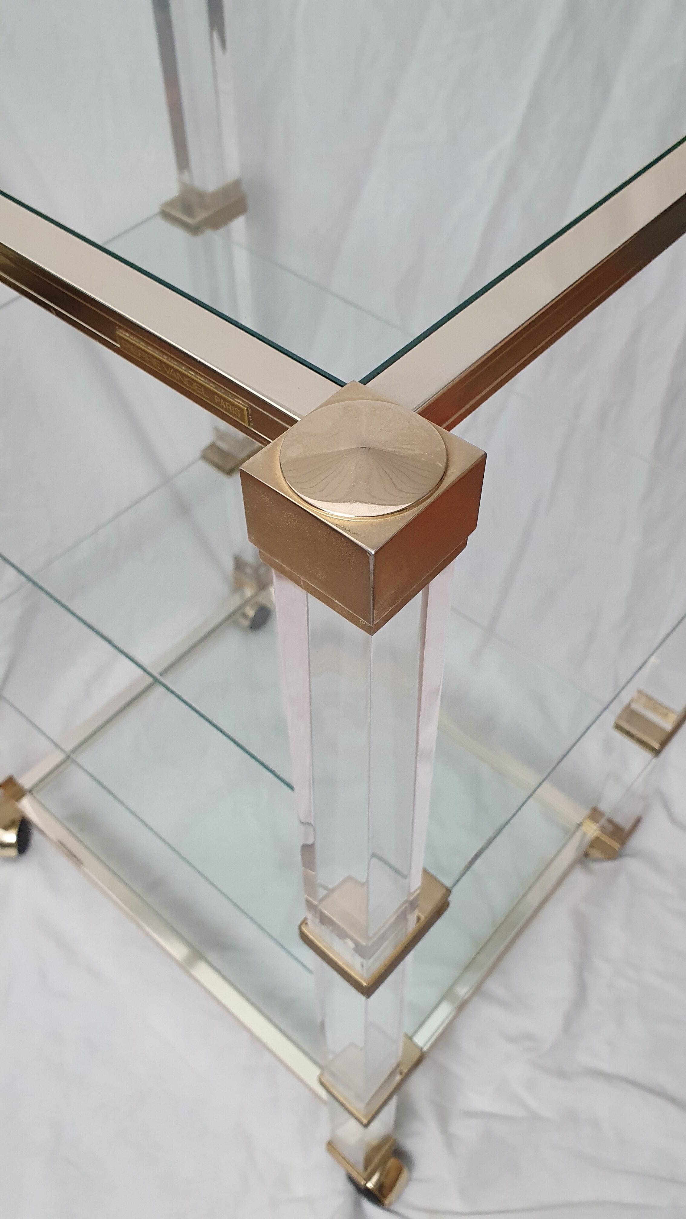 Rolling glass and plexiglass shelf by Pierre Vandel