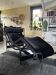 Armchair, black leather chaise longue model LC4 Le Corbusier
