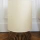 Table lamp with rattan base and papier-mâché hat