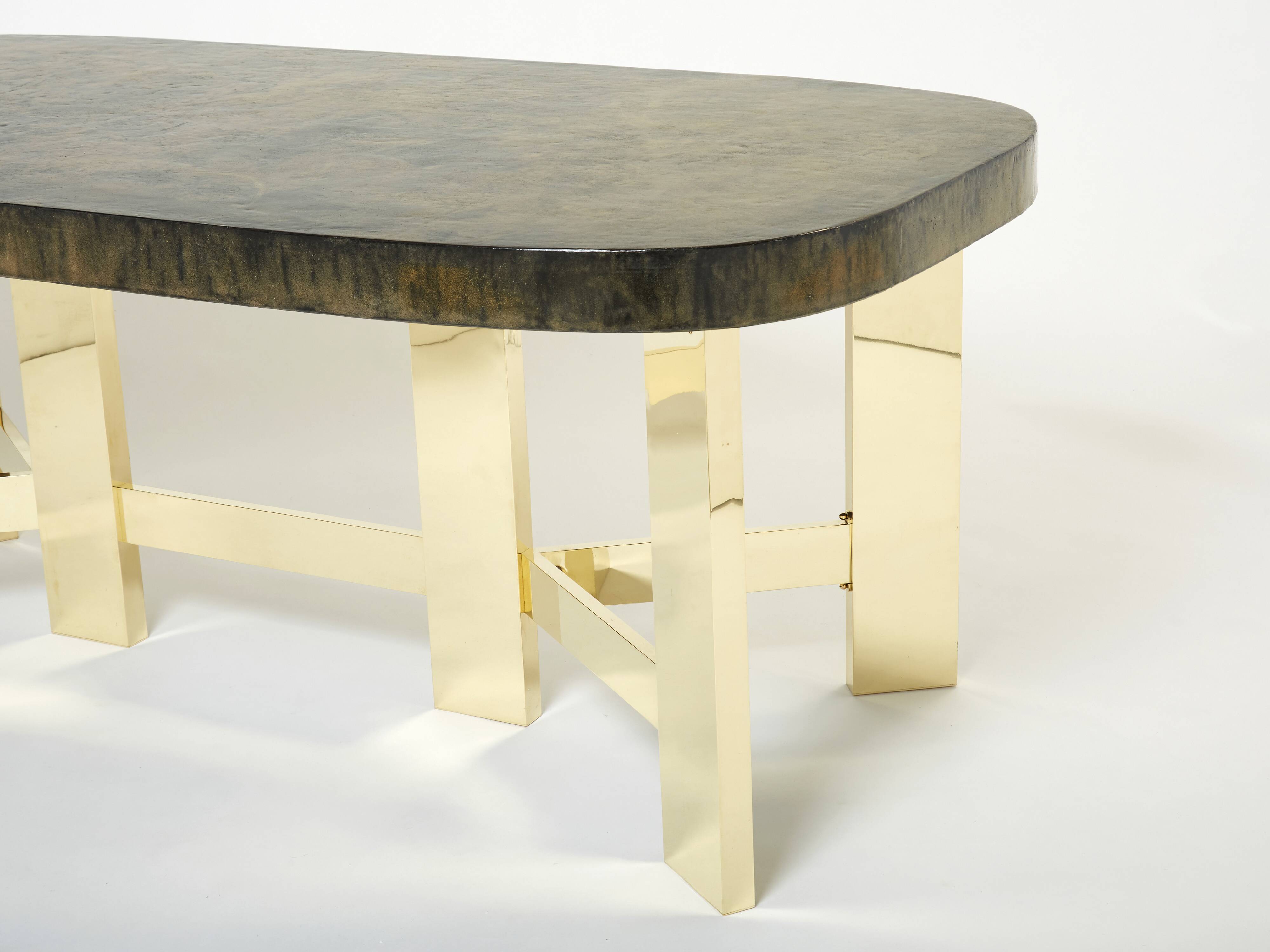 Brutalist Belgian dining table in resin and brass from around 1970.