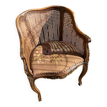 Fauteuil en bois sculpté et cannage