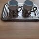 2 porcelain coffee cups with cup holder and metal tray