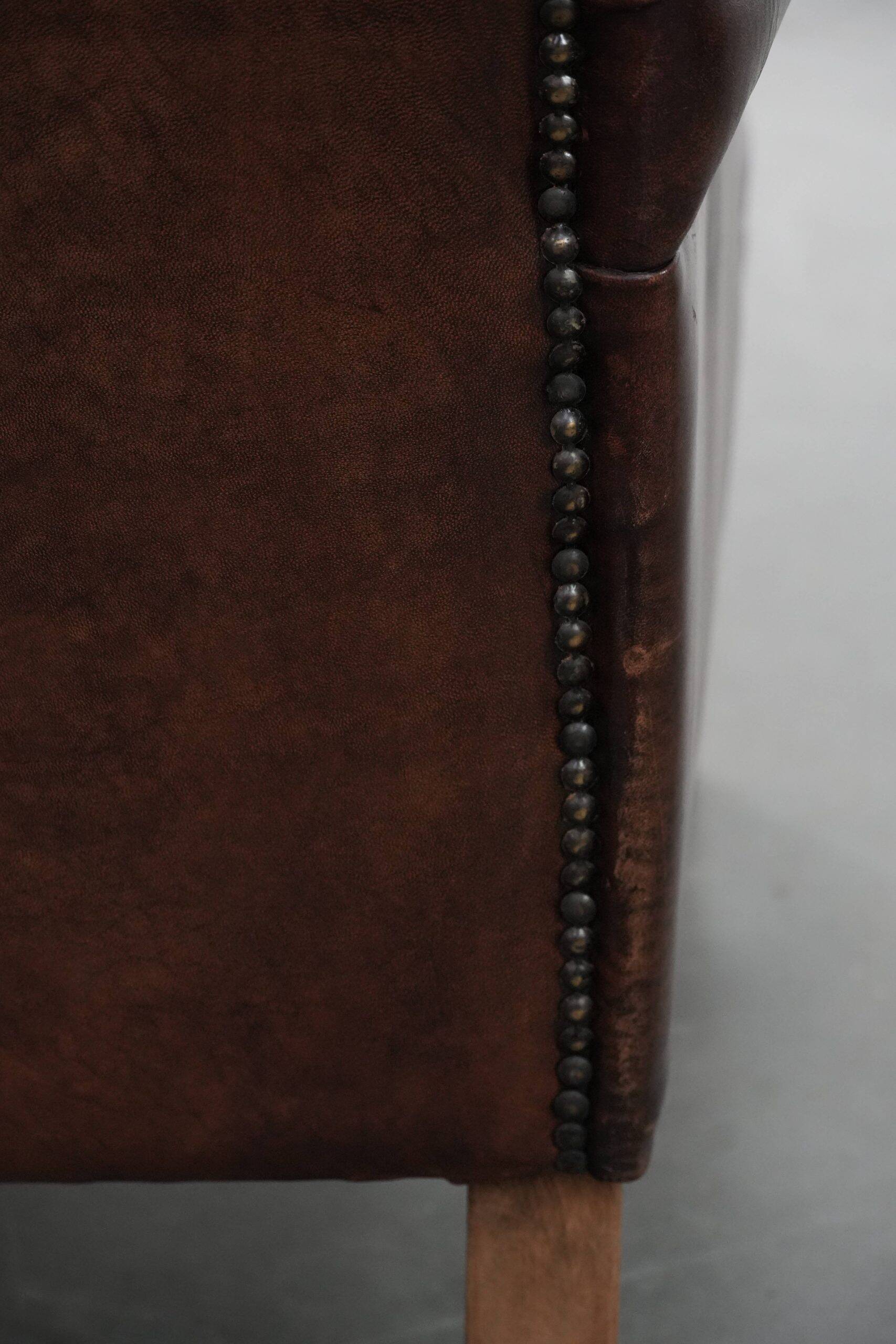 Set of two characterful sheepskin armchairs with a beautiful deep colour