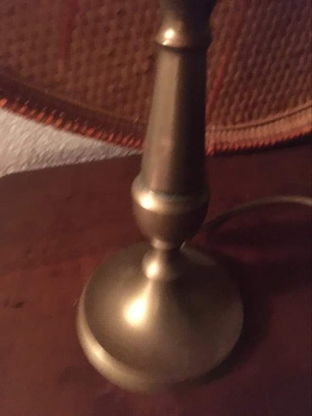 Table lamp at the foot candlestick