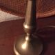 Table lamp at the foot candlestick
