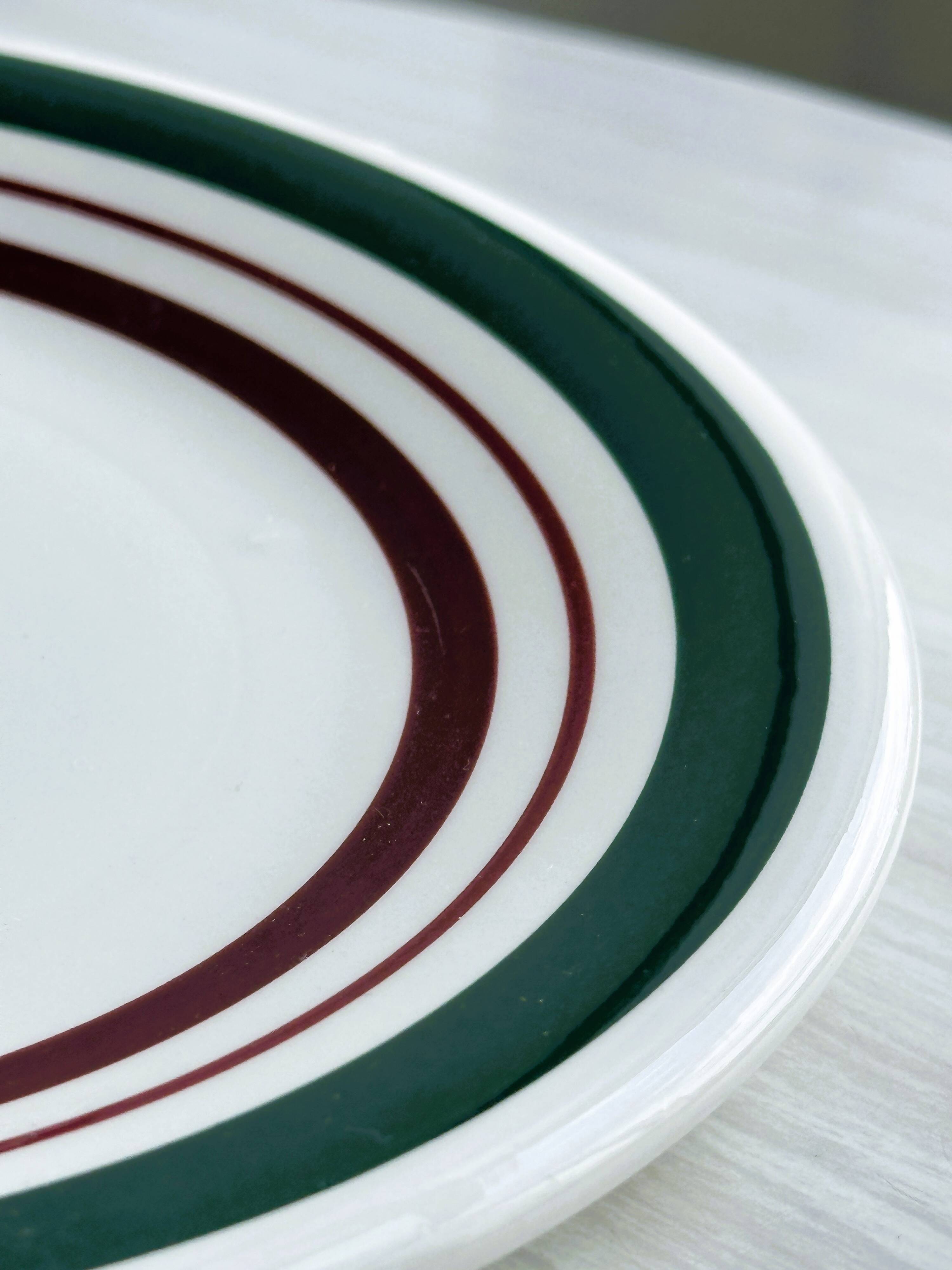 2 green and burgundy strip dessert plates.