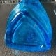 Blue chiseled glass bottle