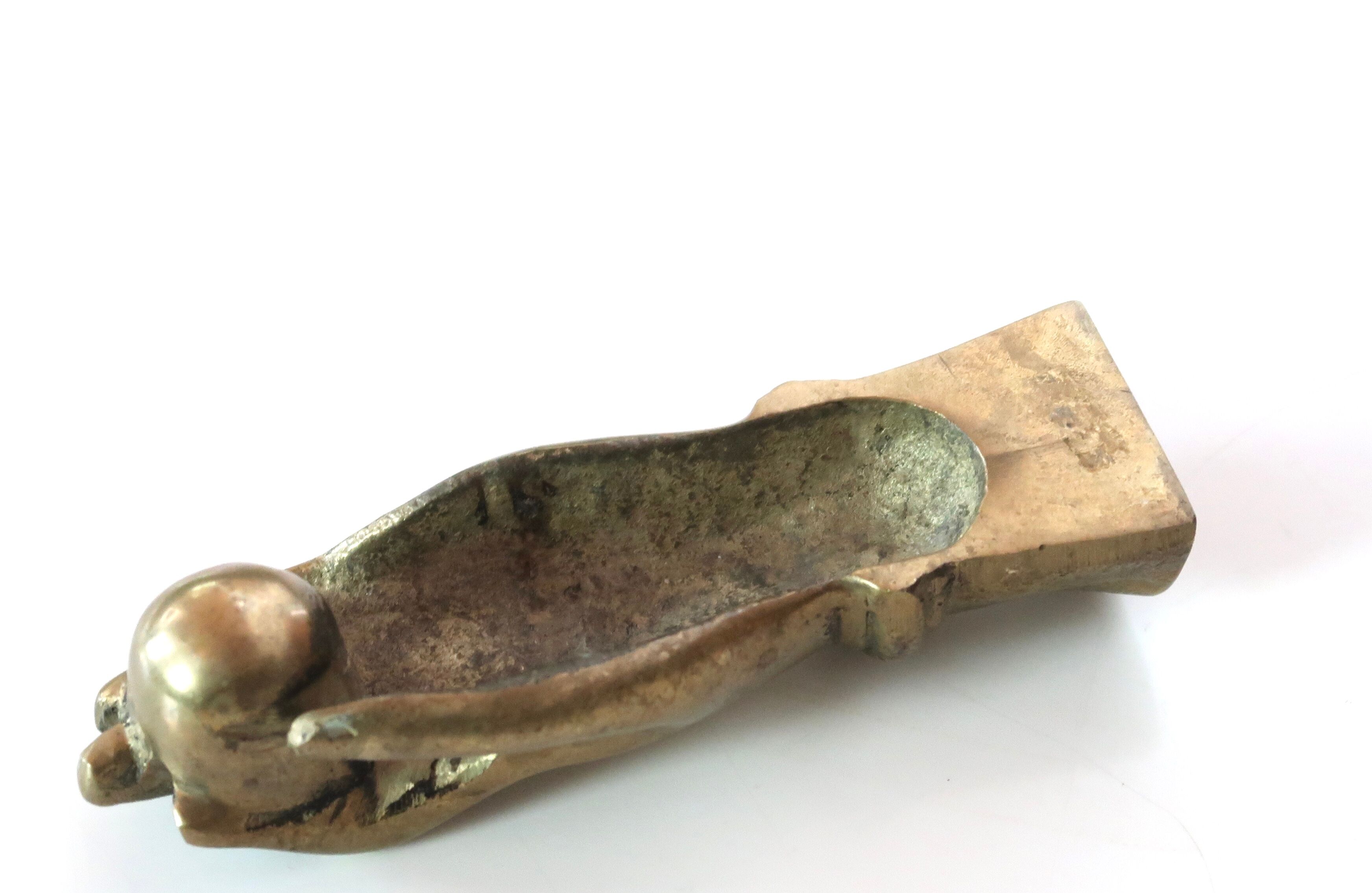 Brass hand, paper press, 50s