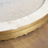 Beveled oval mirror and gilded wood frame