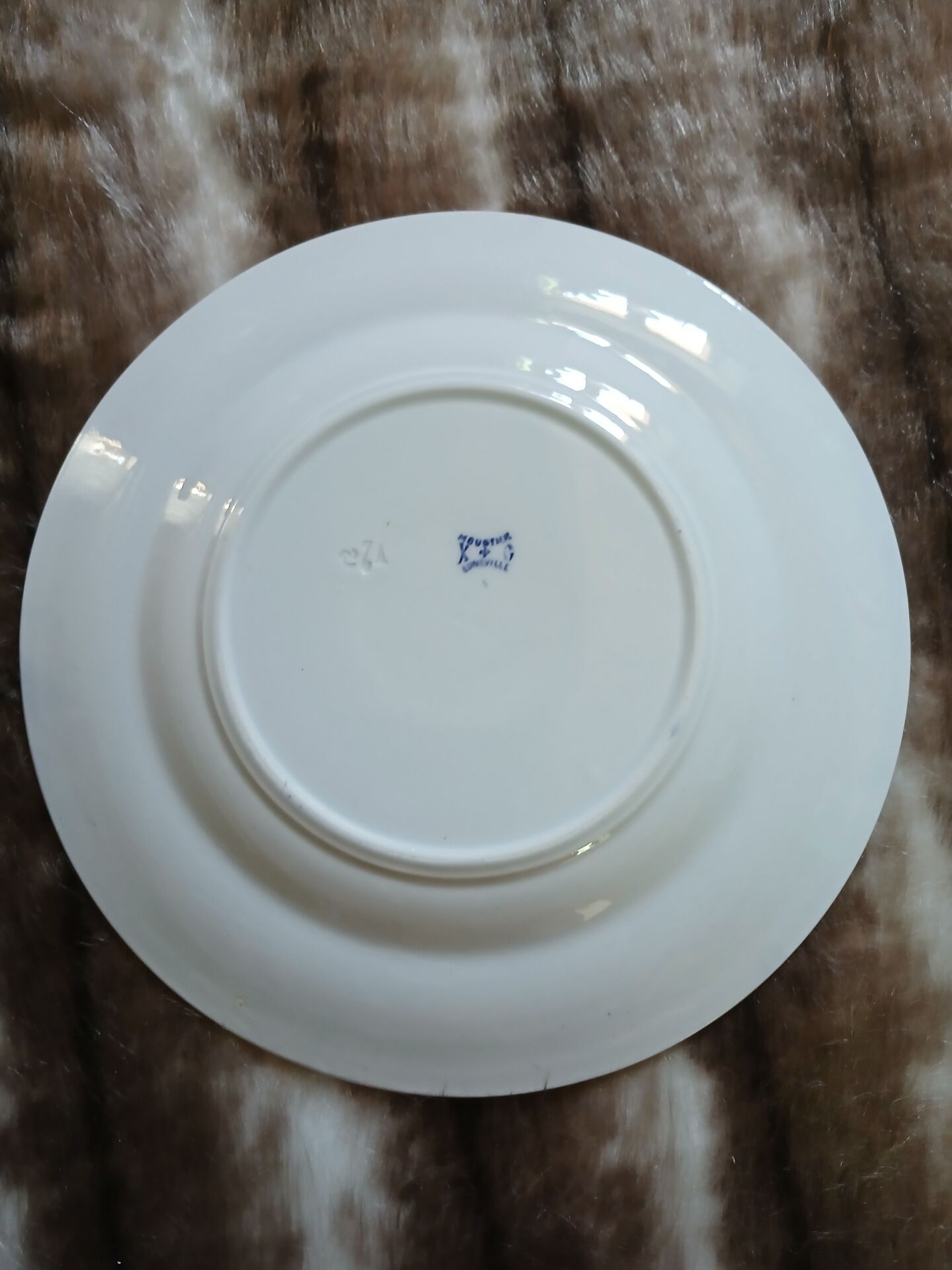 13 mismatched flat plates in ironstone