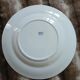 13 mismatched flat plates in ironstone