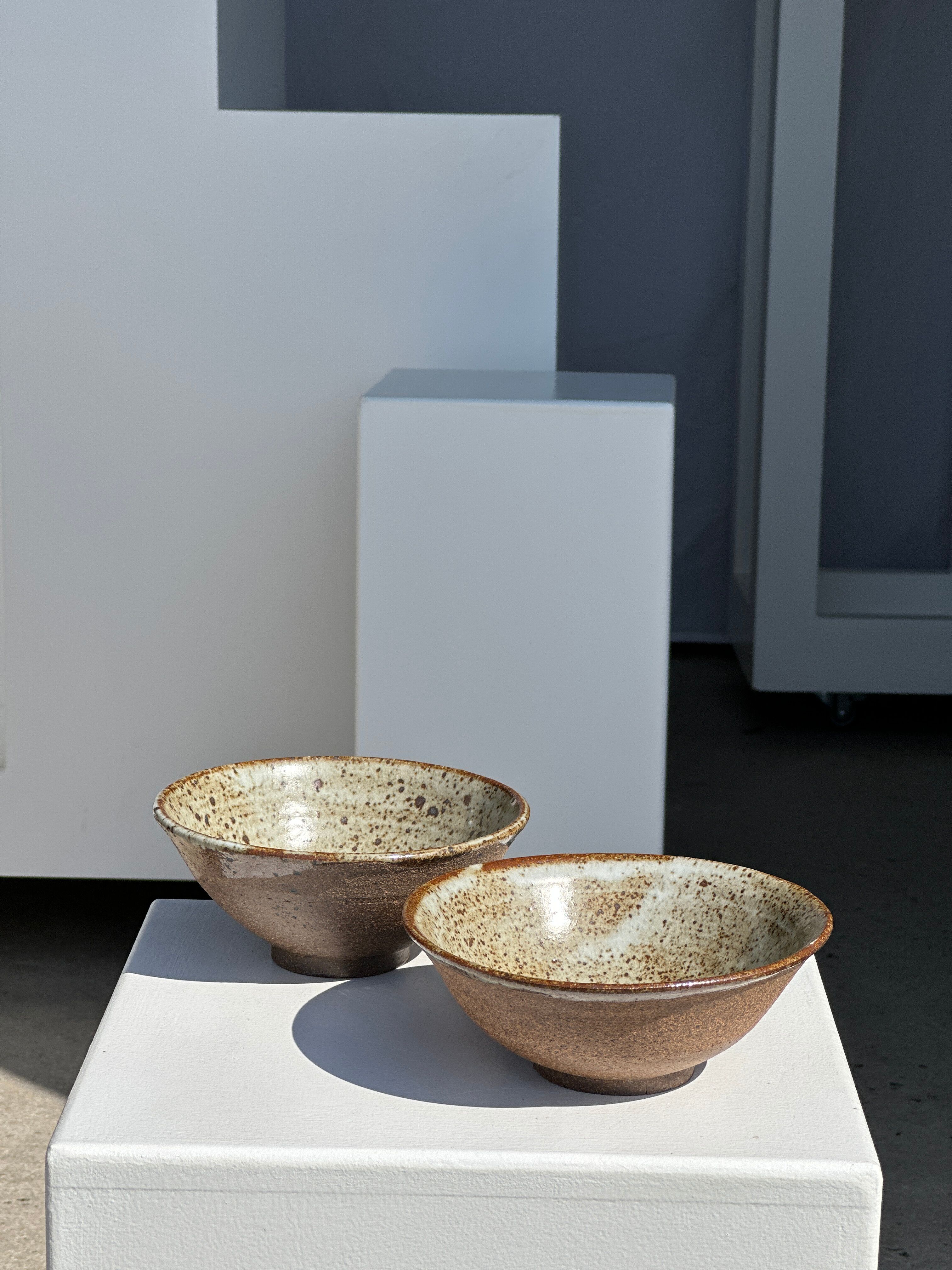 Duo of ceramic bowls interior glazed exterior matt raw earth