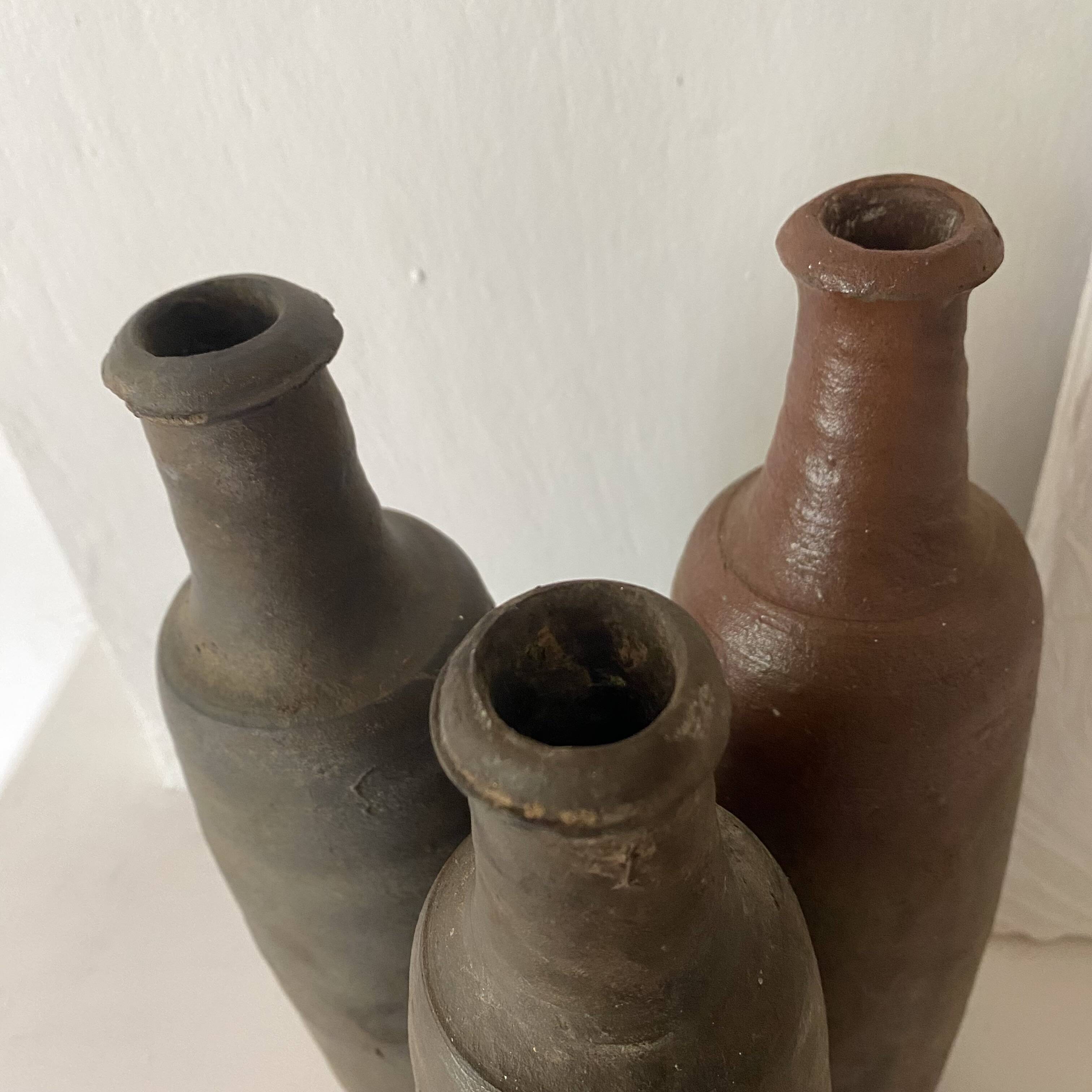 Antique terracotta cider bottles
