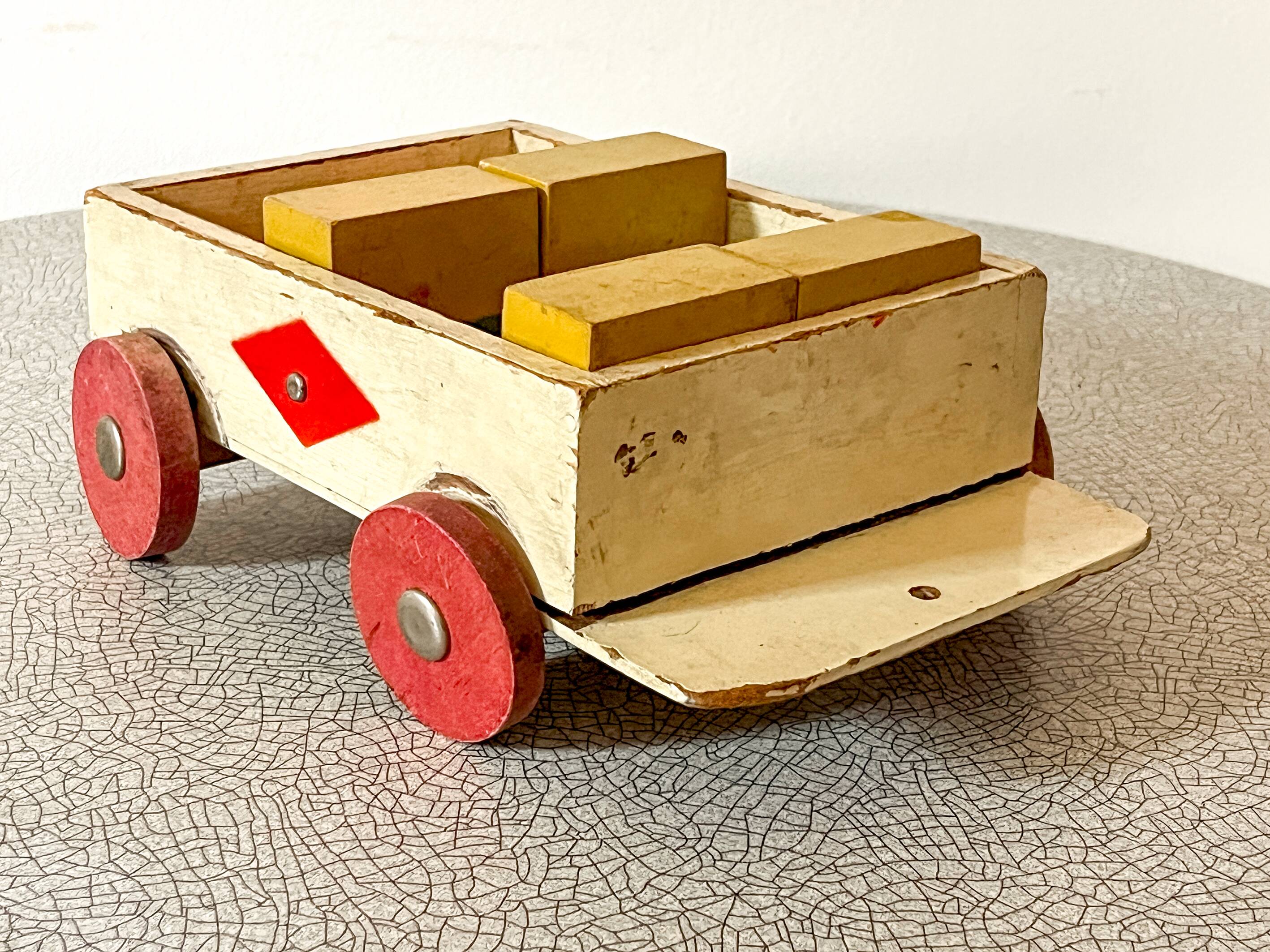 Wooden pull-along toy with coloured blocks, vintage toy.