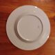 Limoges porcelain plate with a blue speckled rim.
