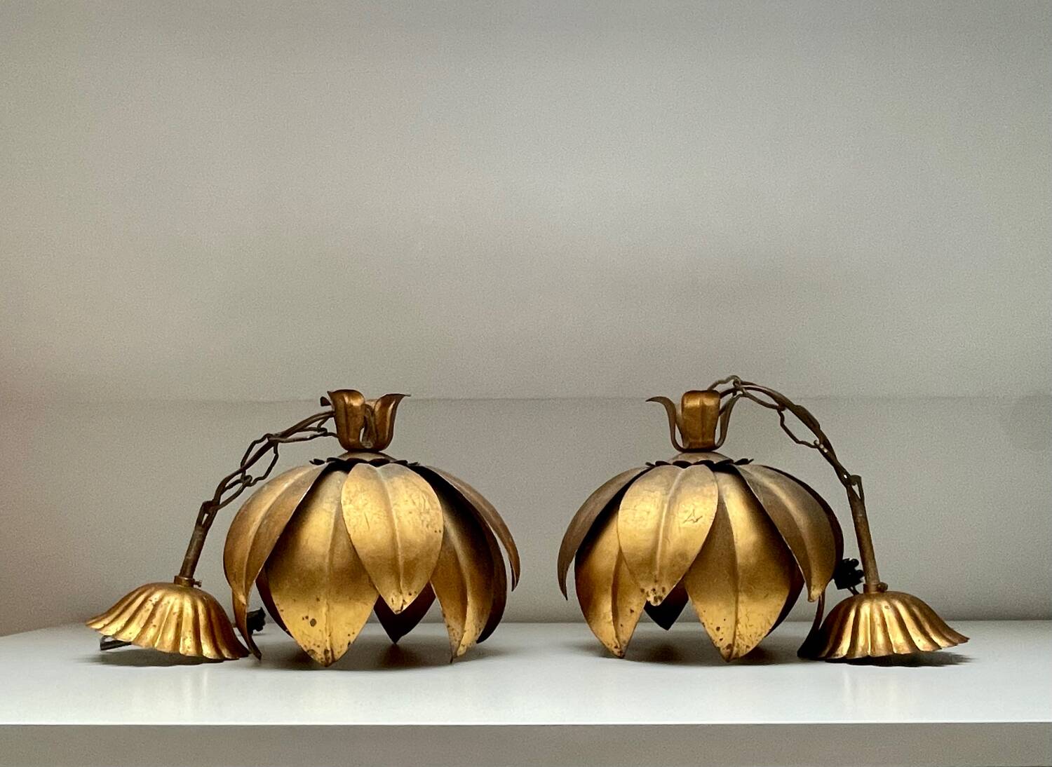 Two vintage pendant lights in gold metal