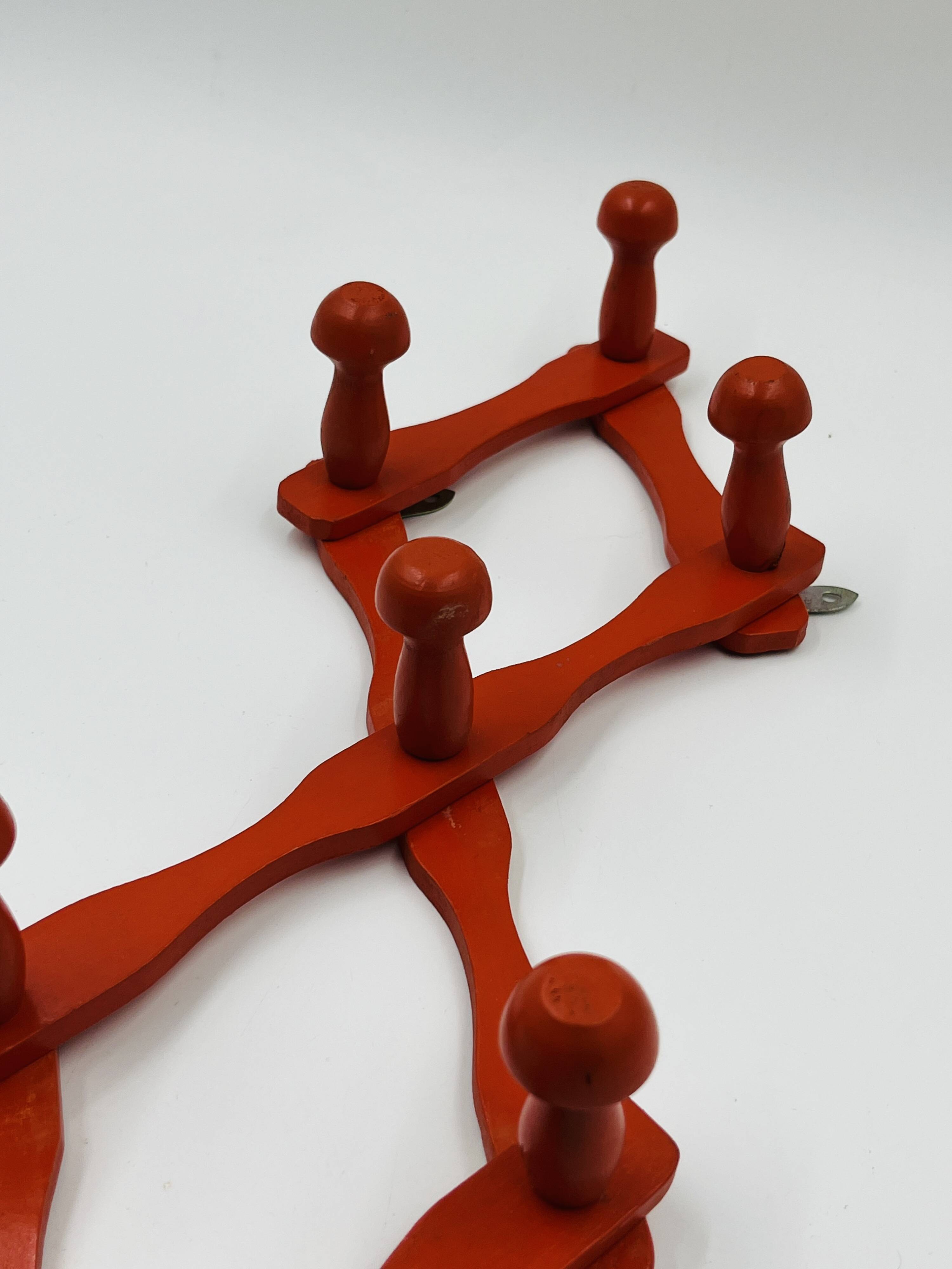Vintage orange accordion coat rack