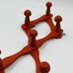 Vintage orange accordion coat rack