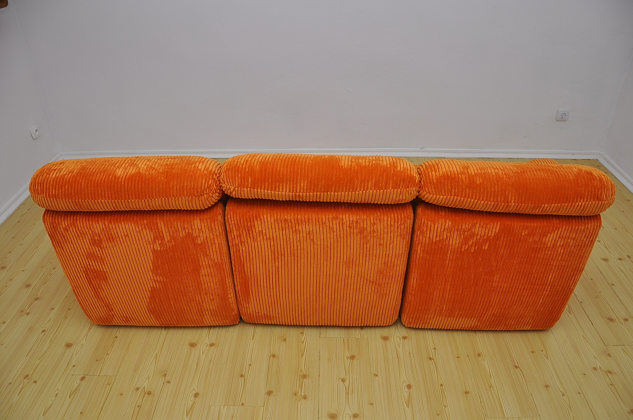 Orange corduroy modular sofa, 1970s.