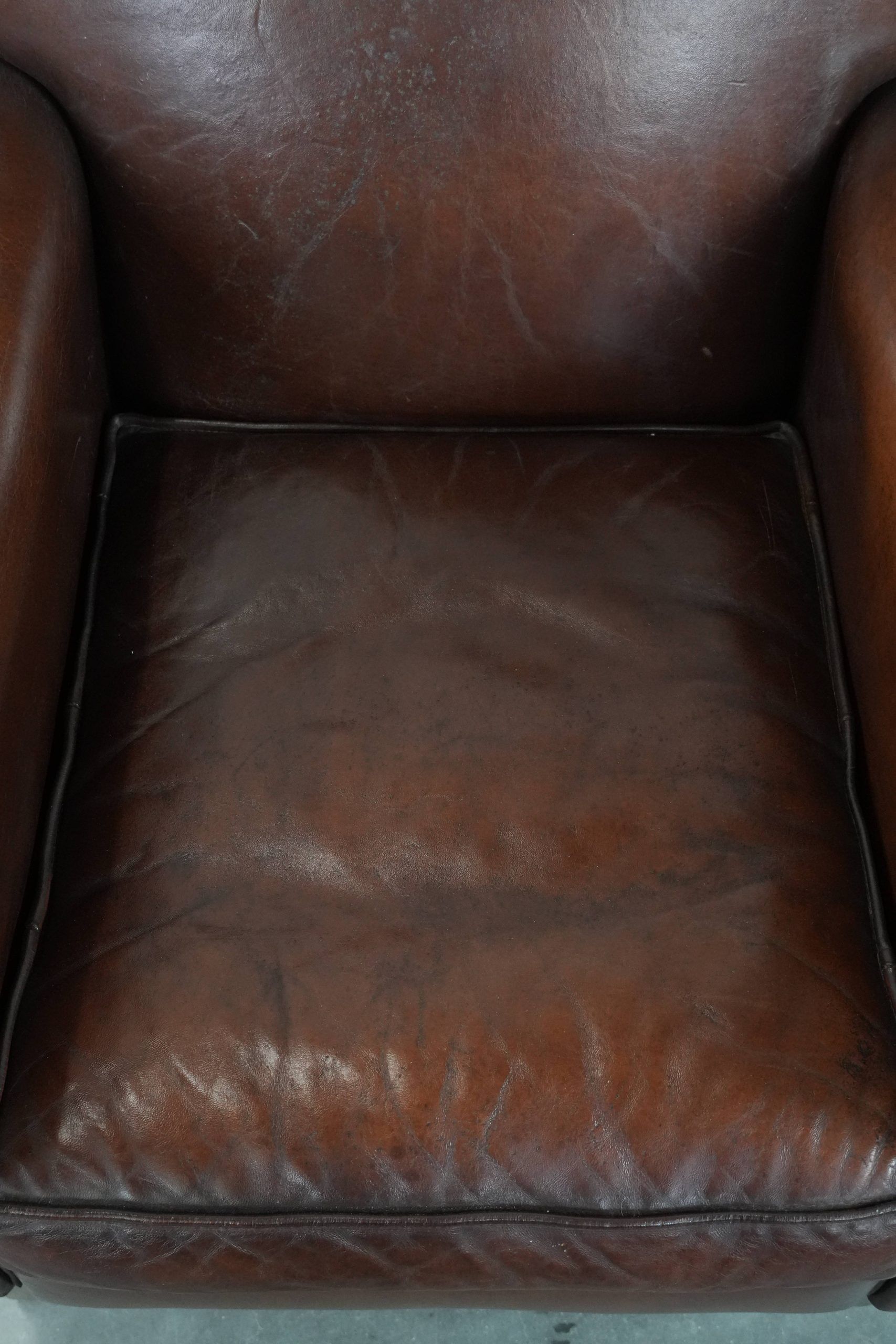 Armchair made of sheepskin leather in art deco design with warm colours