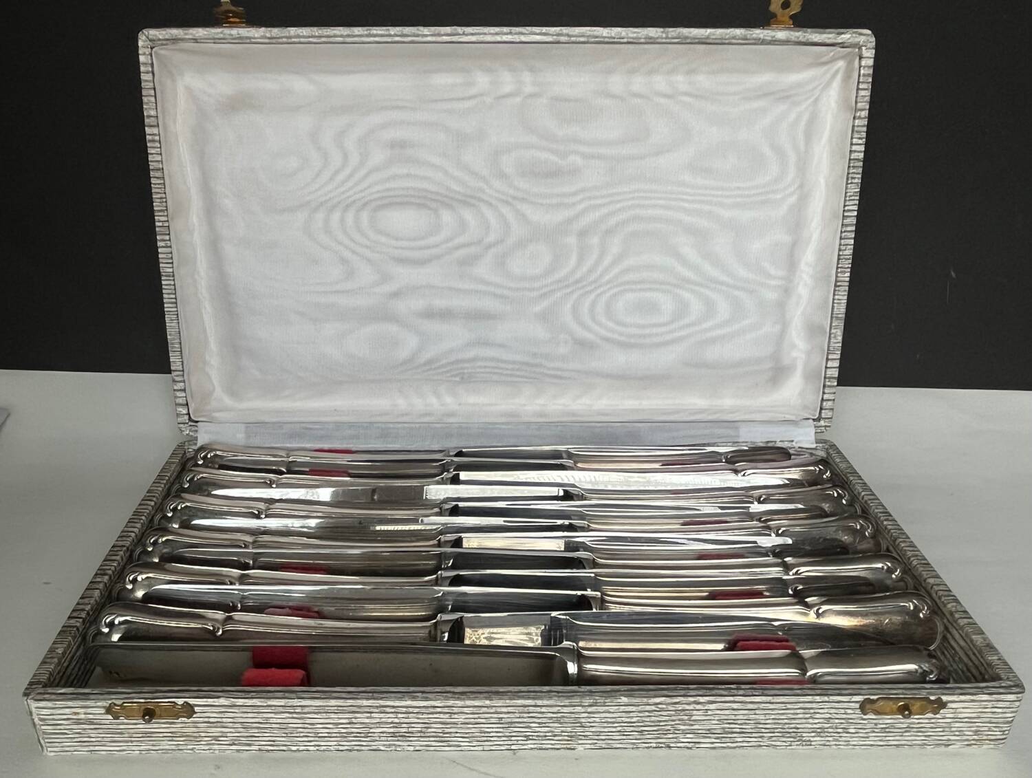 12 silver metal knives