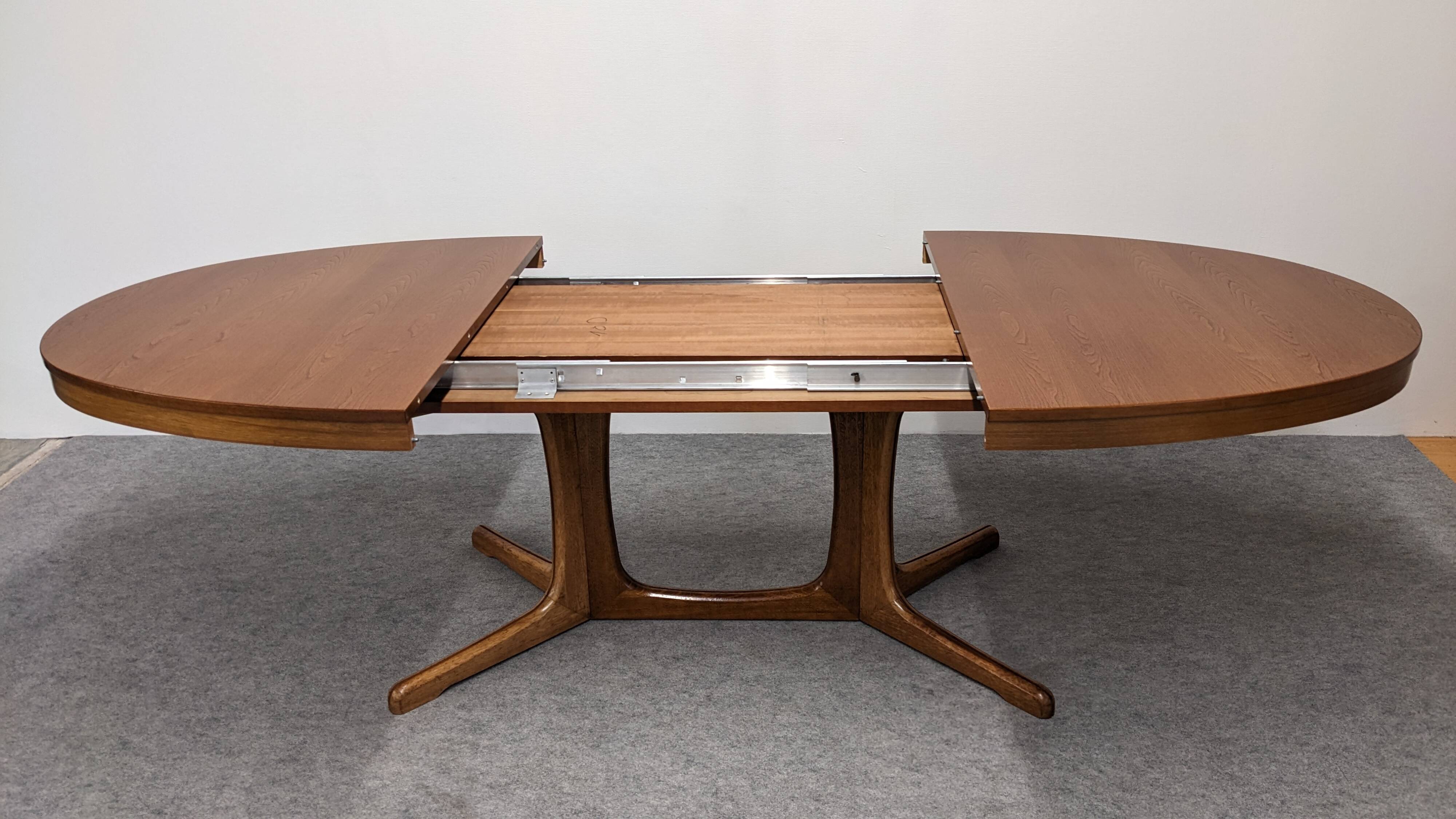 Oval extendable dining table by Baumann, France circa 1970.