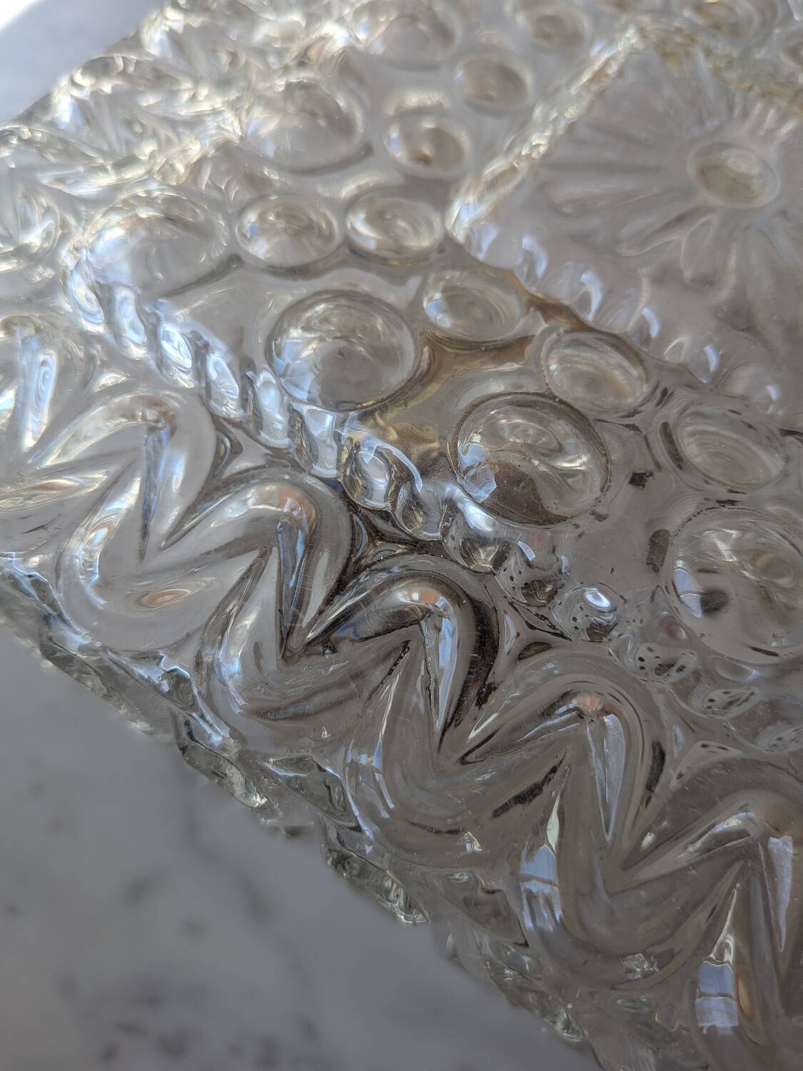 Pressed glass wall light